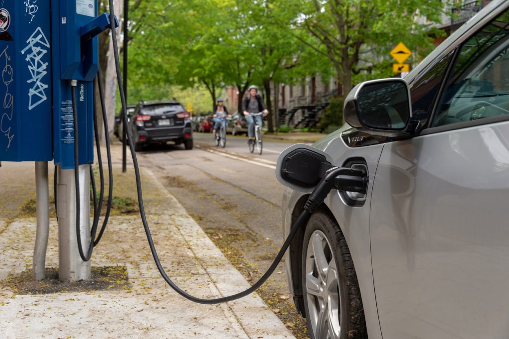 Electric car plugged into an EV charging station