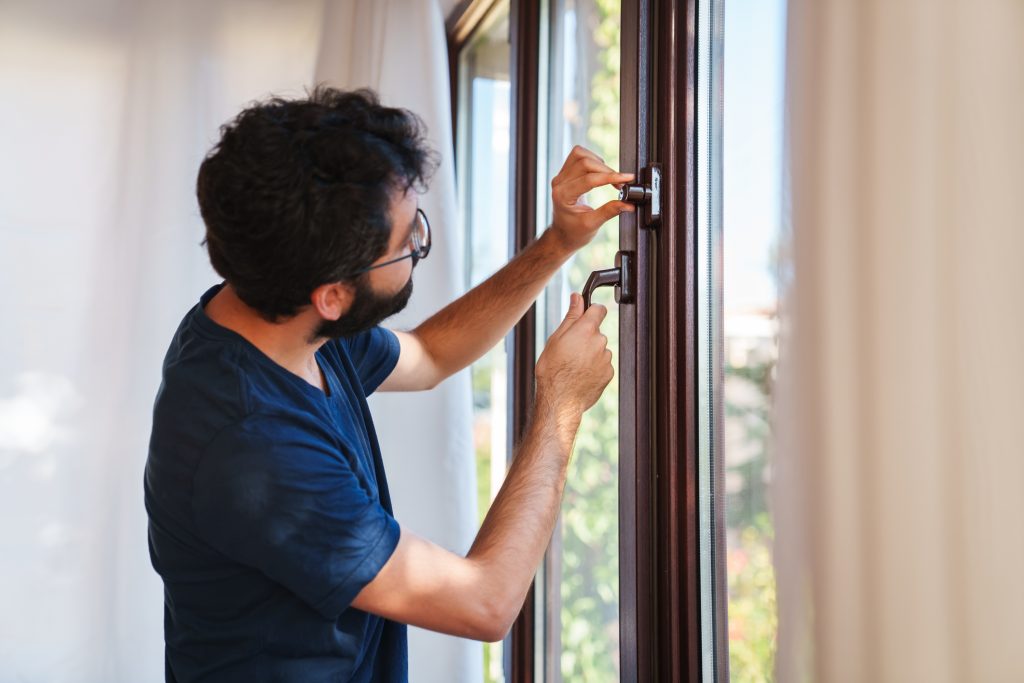 Man opening window