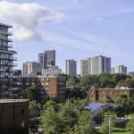 A view of Toronto. Trees are mixed in with high rise residential buildings and low rise apartments