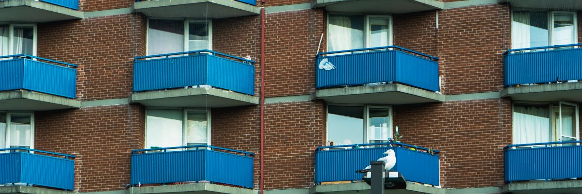 Balconies sit in rows and columns on the exterior of a Toronto apartment building