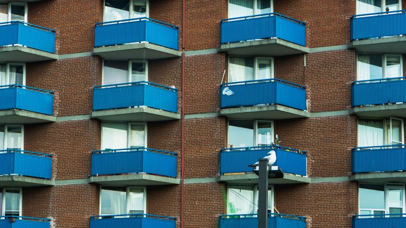 Balconies sit in rows and columns on the exterior of a Toronto apartment building