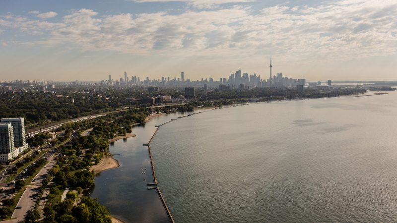 A view of Toronto's skyline from the west, looking over the coast of Lake Ontario